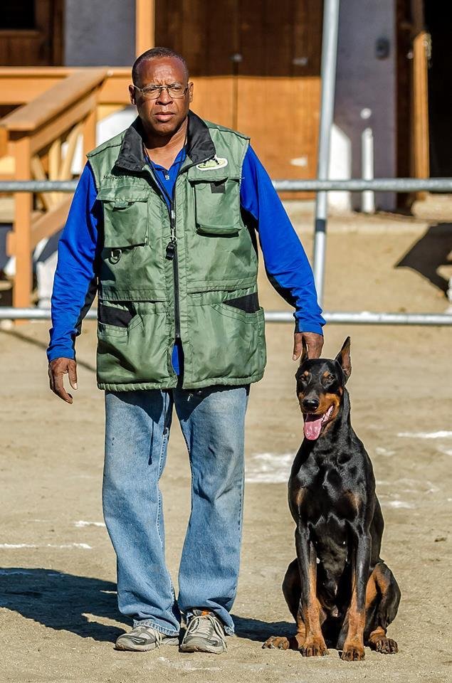 Daryl Young with Doberman